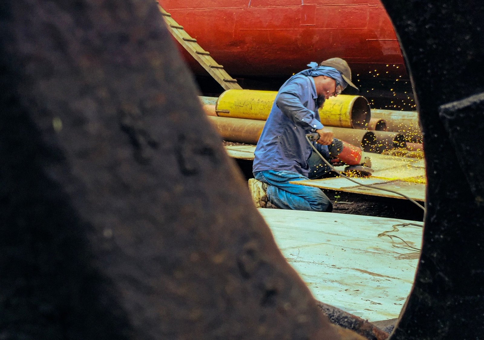 A welder working on a ship.