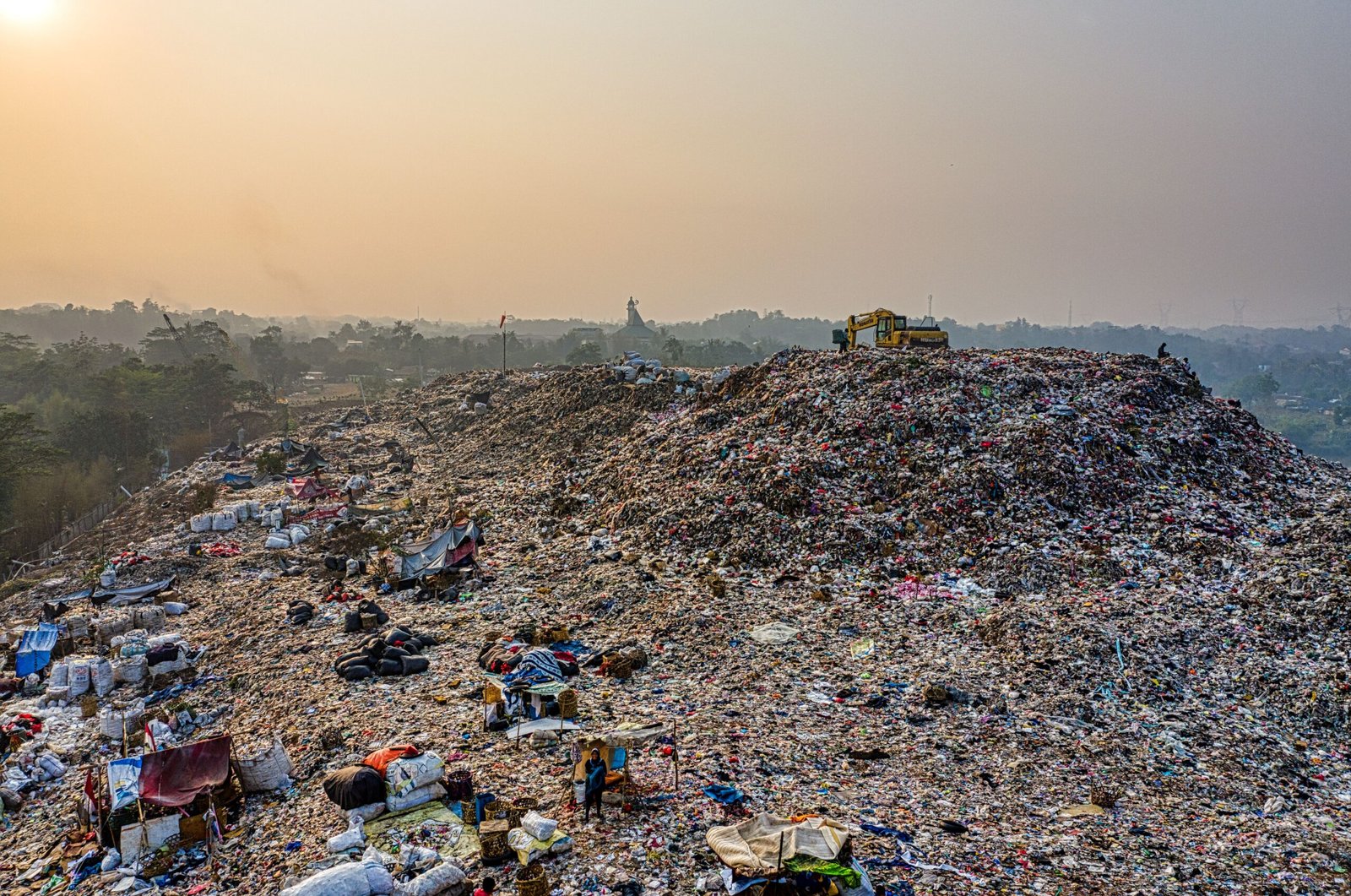 Garbage dump of clothes, fabrics and other waste.
